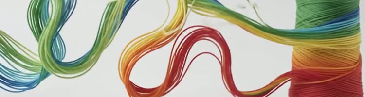 A cone of yarn taking colour